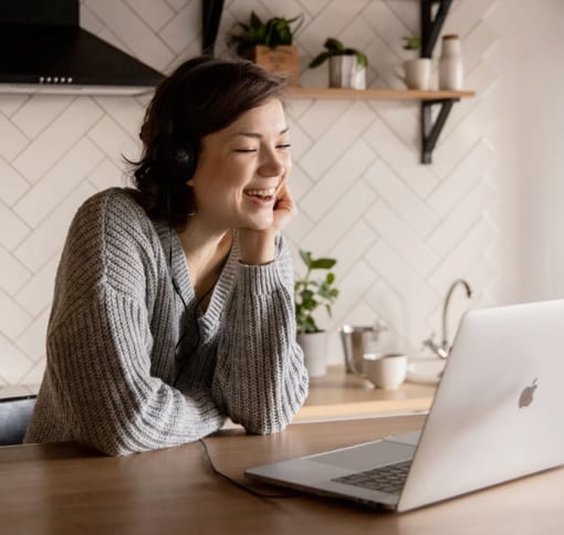 Photo of a woman making a video call on her laptop